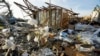 Debris is what remains from a house destroyed by the Friday night tornado in Rolling Folk, Miss., March 26, 2023. The area is quiet after families, friends and neighbors spent most of Saturday trying to salvage their possessions.
