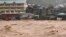 Vehicles are seen submerged as water rises along Chico River in Bontoc, Mountain Province as Super Typhoon Doksuri passes close to the northern tip of Luzon Island. (Photo by Handout / Mountain Province Disaster Risk Reduction Management Office / AFP)