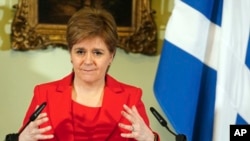 FILE - Nicola Sturgeon speaks during a press conference at Bute House in Edinburgh, Feb. 15 2023. Former Scottish first minister has been arrested by police investigating the finances of Scotland's pro-independence governing party.