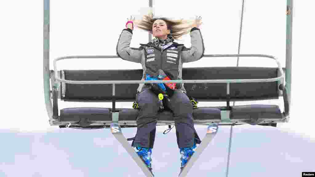 Roberta Melesi of Italy fixes her hair on the ski lift during practice runs for the Stifel Killington Cup FIS World Cup giant slalom race at Killington Resort in Vermont. (Erich Schlegel-USA Today Sports)