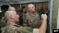 FILE - This handout picture released Sept. 14, 2023 shows Lebanese Army Chief Joseph Aoun meeting with soldiers at the Mohammad Zgheib Barracks in Sidon. (AFP photo / handout / Twitter account of the Lebanese Army)