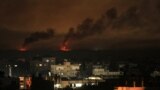A picture taken from Rafah shows smoke billowing following Israeli bombardment of Khan Yunis in the southern Gaza Strip on Dec. 9, 2023, amid continuing battles between Israel and the militant group Hamas. 