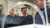 Britain's Prime Minister Rishi Sunak, center, and Grant Shapps, Secretary of State for Energy Security and Net Zero, left, are shown robotics by an apprentice, during a visit to the UK Atomic Energy Authority, Culham Science Centre, in Abingdon, England, March 30, 2023. 