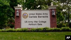 FILE - An entrance sign is seen outside the US Army's Carlisle Barracks, June 10, 2022, in Carlisle, Pa.