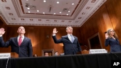 Homeland Security Secretary Alejandro Mayorkas, left, FBI Director Christopher Wray, middle, and National Counterterrorism Center Director Christine Abizaid are sworn in before testifying during a Senate committee hearing in Washington, Oct. 31, 2023.