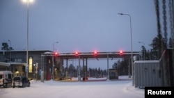 Red lights are seen at the Raja-Jooseppi international border crossing station in Inari, northern Finland, on Nov. 29, 2023. (Lehtikuva/Otto Ponto via Reuters)