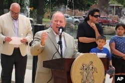 Detroit Mayor Mike Duggan dedicates a splash pad in Clark Park, in southwest Detroit, June 22, 2023.