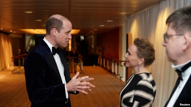 The Prince of Wales, president of BAFTA, talks with Anna Higgs, chairwoman of Bafta's Film Committee at the BAFTA Film Awards 2024, at the Royal Festival Hall, Southbank Centre, London, Feb. 18, 2024. (Jordan Pettitt/Pool via Reuters)