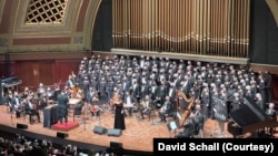 The National Arab Orchestra (NAO)performs onstage with supporting chorus. (Courtesy NAO/David Schall)