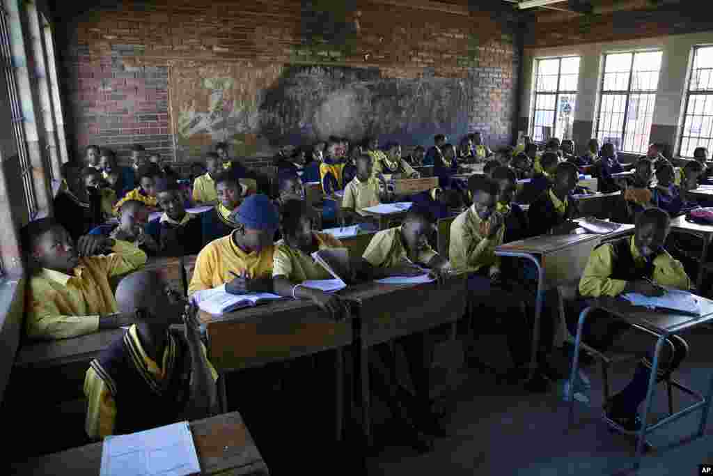 Students attend a class at the Seipone Secondary School in the rural village of Ga-Mashashane, near Polokwane, South Africa, Thursday May 4, 2023. Human rights groups have been pressuring the government for a decade to get rid of pit toilets in schools, with the issue given added urgency by several tragic cases of young children falling into the pits and drowning.&nbsp;