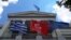 FILE - From left, Greek Turkish and European Union flags flutter in front of the Greek Foreign Ministry building ahead of a meeting of Greek and Turkish officials, in Athens, May 31, 2021. Delegations from both countries met Monday at the Defense Ministry in Athens.