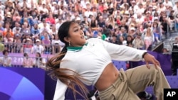 FILE - United States Logan Edra, known as B-Girl Logistx, left, competes during the Round Robin Battle at the breaking competition at La Concorde Urban Park at the 2024 Summer Olympics, Aug. 9, 2024, in Paris, France. 