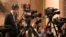 FILE - A videographer with China Media Group (CMG) films during a press conference at the Great Hall of the People in Beijing, March 4, 2023. Indonesian network Metro TV signed an agreement with CMG in November 2023 to expand some of its content.