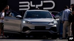 FILE - Visitors check out the China-made BYD ATTO 3 at the IAA motor show in Munich, Germany, Sept. 8, 2023. As early as May 14, 2024, the Biden administration reportedly will announce new tariffs on some Chinese products, including electric vehicles.