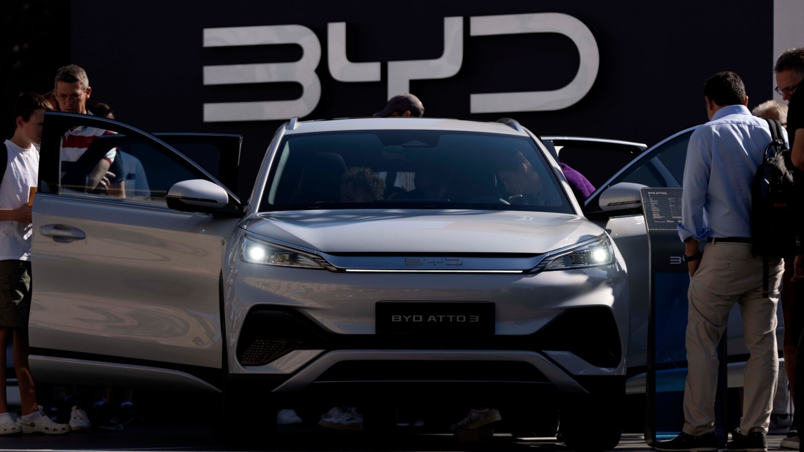 FILE - Visitors examine the China-made BYD ATTO 3 at the IAA motor show in Munich, Germany, Sept. 8, 2023. Myanmar's drivers are shifting to electric vehicles, a move that underscores the military junta's growing ties with China, where most EVs and component parts are made.