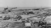 This image provided by Naval History and Heritage Command shows the wreckage of the Building A-7 Joiner Shop in the center and munitions pier beyond, from the July 17, 1944 explosion at Port Chicago naval weapons station near San Francisco. 