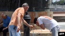 Men cool off in Skopje, North Macedonia, as Europe braced for record-smashing heat on July 18, 2023.