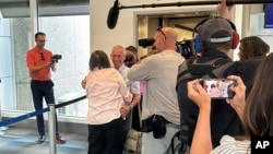 Ann Meddin Hellman embraces her cousin, Shalom Korai, as they meet for the first time in North Charleston, South Carolina, July 10, 2024. Korai was orphaned during the Holocaust and never knew any of his blood relatives until he took a DNA test last year.