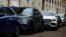 FILE - SUVs are parked on a street in Paris, France, Nov. 20, 2023.