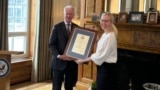 Journalist Jessikka Aro receives the Ambassador Hickey Woman of Courage Award at the U.S. Embassy in Finland in this image posted on X on June 7, 2024.