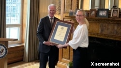 Journalist Jessikka Aro receives the Ambassador Hickey Woman of Courage Award at the U.S. Embassy in Finland in this image posted on X on June 7, 2024.