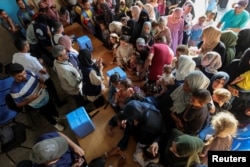 Palestinians gather for a polio vaccination campaign, at a United Nations healthcare center in Deir Al-Balah in the central Gaza Strip, September 1, 2024. (REUTERS/Ramadan Abed)