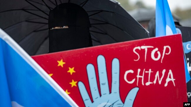 FILE - Ethnic Uyghurs take part in a protest against China near the Chinese Consulate in Istanbul, on Oct. 1, 2023, China's National Day.