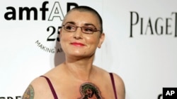 FILE - Irish musician Sinead O'Connor arrives at amfAR's Inspiration Gala in Los Angeles, Oct. 27, 2011. O’Connor, known as much for her private struggles and provocative actions as for her fierce and expressive music, has died at 56.