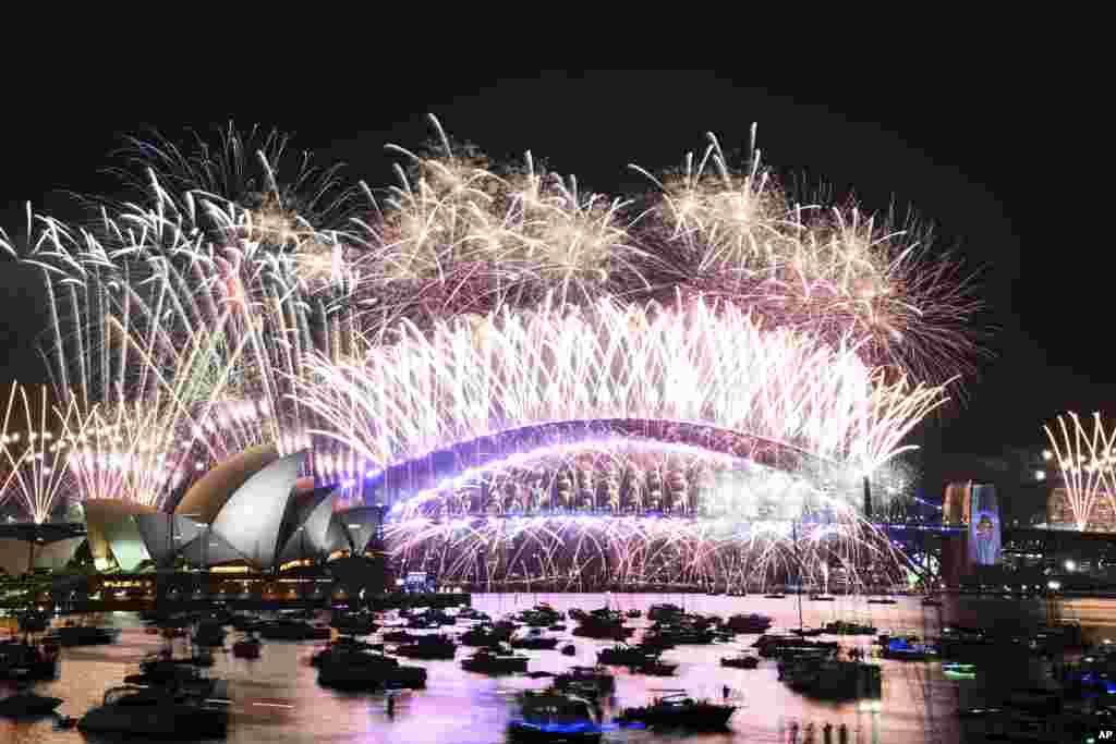 Fireworks explode over the Sydney Opera House and on the Harbour Bridge as part of New Year's Eve celebrations in Sydney, Jan. 1, 2024.