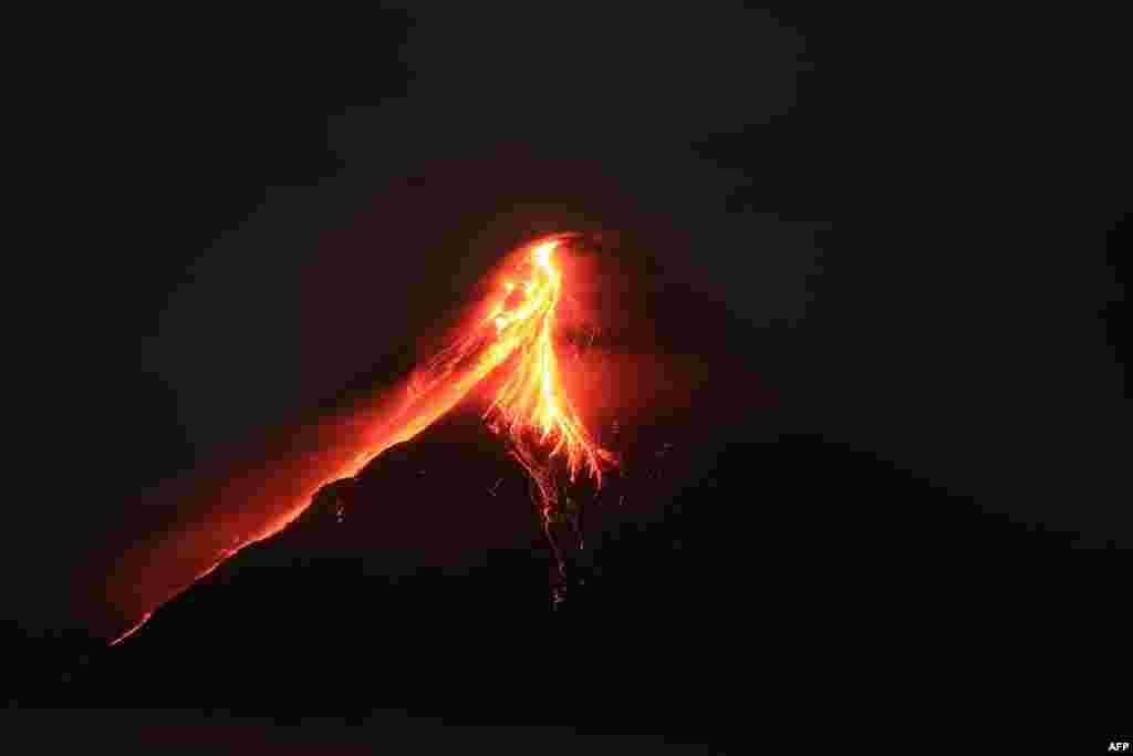 Mount Mayon spews lava during an eruption near Legazpi city in Albay province, south of Manila, Philippines.