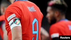 FILE - England captain Harry Kane wears a OneLove armband in rainbow colors during a UEFA Nations League match against Germany at London's Wembley Stadium, Sept. 26, 2022.