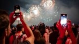 FILE - People watch the Macy's Fourth of July fireworks in New York, Tuesday, July 4, 2023. (AP Photo/Yuki Iwamura)