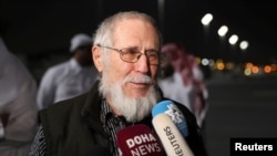 Released Taliban hostage and Austrian national Herbert Fritz speaks with the media after disembarking from a plane, in Doha, Qatar, Feb. 25, 2024. 