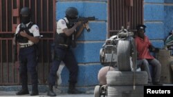 FI:LE: Police officers take position as they take part in an anti-gang operation amid gang violence in Port-au-Prince, Haiti March 3, 2023.