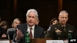 FILE - CIA Director William Burns, left, testifies during a Senate Intelligence Committee hearing on worldwide threats in Washington, March 8, 2023.