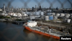 FILE - The Houston Ship Channel and adjacent refineries, part of the Port of Houston, are seen in Houston, May 5, 2019. A cargo of sanctioned Iranian crude oil that was confiscated by the United States has been sitting off the Texas coast for eight weeks as of July 25, 2023.