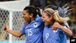 France's Eugenie Le Sommer, right, with Kenza Dali after scoring their first goal in the Women's World Cup Group F match between France and Brazil, Brisbane, Australia, July 29, 2023.