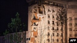 This photograph shows a residential building damaged by a Russian missile strike in Dnipro, July 28, 2023. 