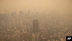 FILE - Haze is visible in New York City from the Empire State Building observatory, June 7, 2023, in New York.