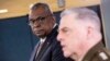 US Defense Secretary Lloyd Austin, left, listens to Chairman of the Joint Chiefs Gen. Mark Milley speak during a briefing at the Pentagon in Washington, March 15, 2023.