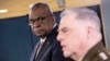 Secretary of Defense Lloyd Austin, left, listens to Chairman of the Joint Chiefs Gen. Mark Milley speak during a briefing at the Pentagon in Washington, March 15, 2023.