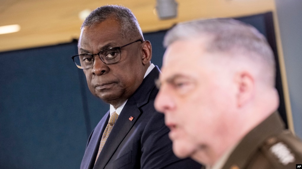 Secretary of Defense Lloyd Austin, left, listens to Chairman of the Joint Chiefs Gen. Mark Milley speak during a briefing at the Pentagon in Washington, March 15, 2023.