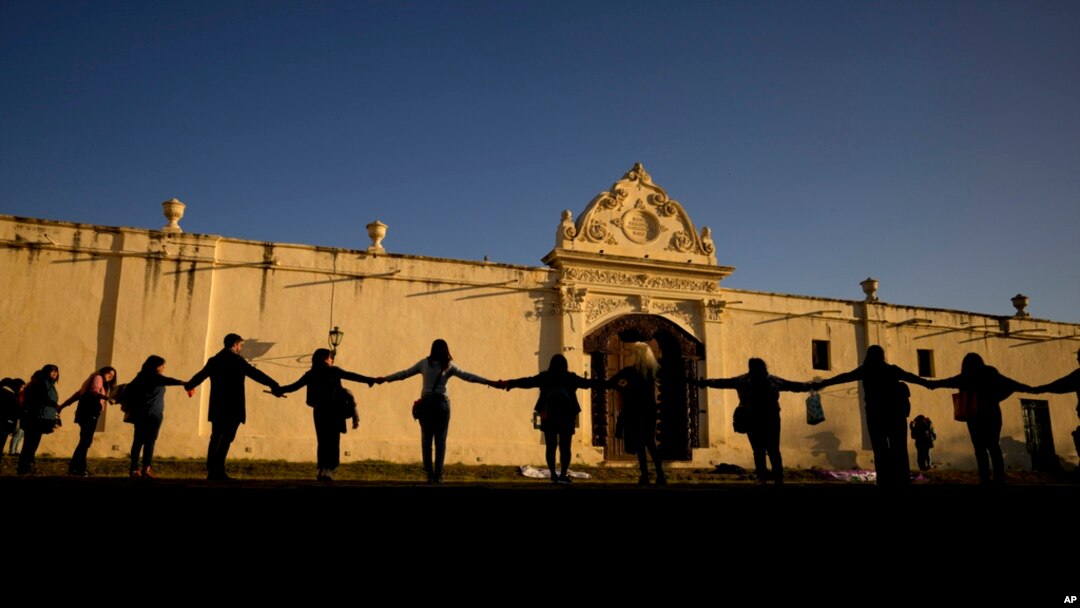 FILE - Women in support of the San Bernardo Convent's in support of the nuns who accused church officials of gender-based psychological and physical violence, in Salta, Argentina, May 3, 2022. 