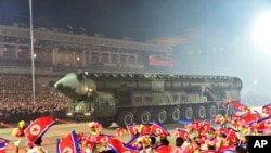 FILE -Photo by the North Korean government, shows what it says is a Hwasong-18 intercontinental ballistic missile during a military parade in Pyongyang, North Korea, July 27, 2023.
