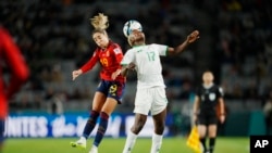 Spain's Olga Carmona, left, jumps for the ball with Zambia's Racheal Kundananji during the Women's World Cup Group C soccer match between Spain and Zambia at Eden Park in Auckland, New Zealand, July 26, 2023.