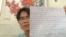 乔鑫鑫得知其在中国老家的亲属遭当局恐吓施压后用中英两种文字写下不自杀声明。(乔鑫鑫提供图片)