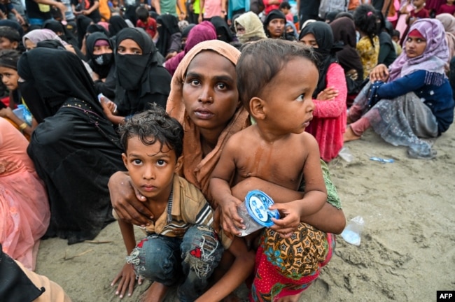 Newly-arrived Rohingya refugees wait to be transferred to a shelter in Batee beach, Aceh province, Indonesia, Nov. 15, 2023. (Photo by CHAIDEER MAHYUDDIN / AFP)