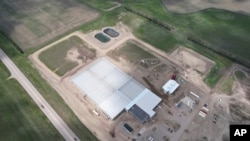 FILE - This aerial photo shows the first phase of the Mandan, Hidatsa and Arikara Nation's Native Green Grow greenhouse operation on May 15, 2024, near Parshall, ND.