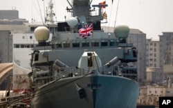 FILE - Britain's Royal Navy warship HMS Westminster sits docked in Gibraltar, Aug. 19, 2013.