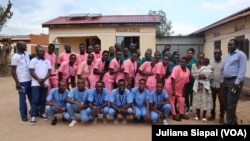 FILE - Students of Gubdue Health Science Institute, staff and tutors pose for a picture in front of the administration block of the Institute in Yambio, Western Equatoria State, South Sudan, Sept. 9, 2023. 